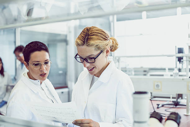 Laboratory assistants study the tests